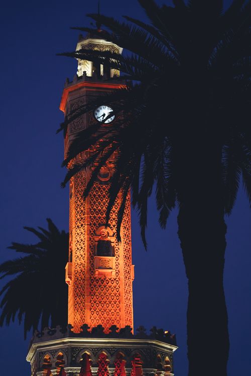 Free Scenic view of the illuminated İzmir Clock Tower set against a beautiful night sky. Stock Photo