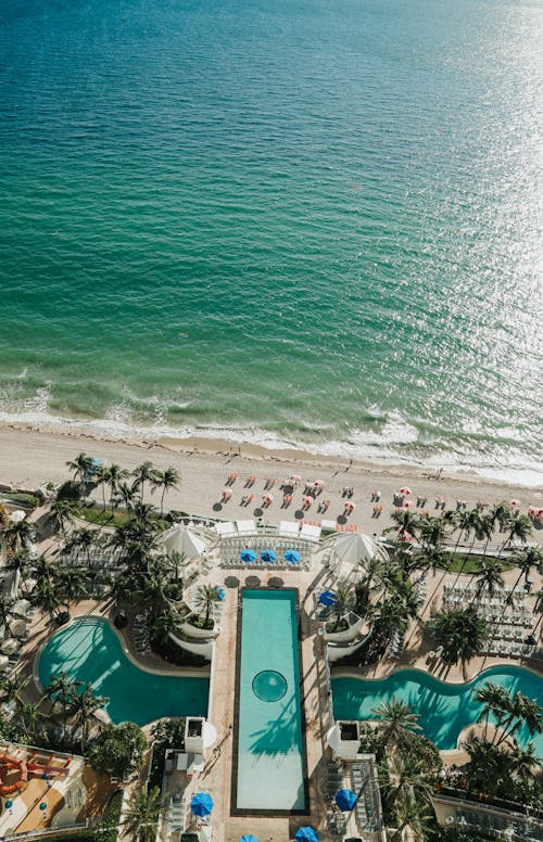 Aerial View of Luxurious Hotel Swimming Pools by Sea Shore