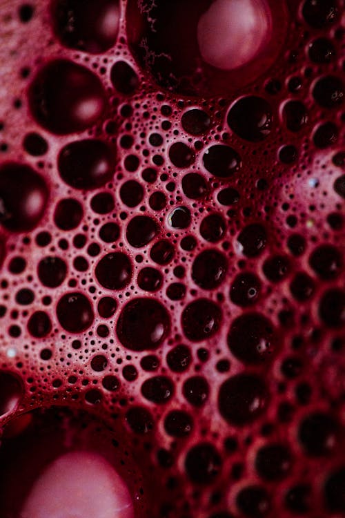 Close-Up Photography of Air Bubbles of Red Liquid