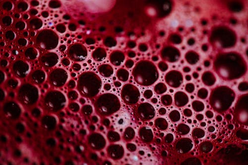 Close-Up Shot of Air Bubbles of Red Liquid