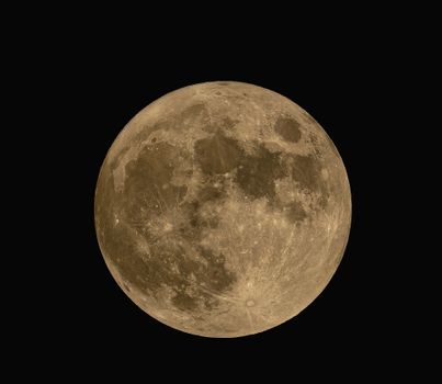 A high-resolution image of the full moon captured against a dark sky, showcasing lunar details.