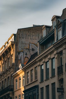 Beautiful view of classic French buildings in Lille, showcasing intricate architecture at dusk.