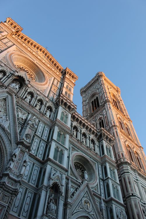 Free Low angle shot of Florence Cathedral's intricate Renaissance architecture at sunset, Italy. Stock Photo