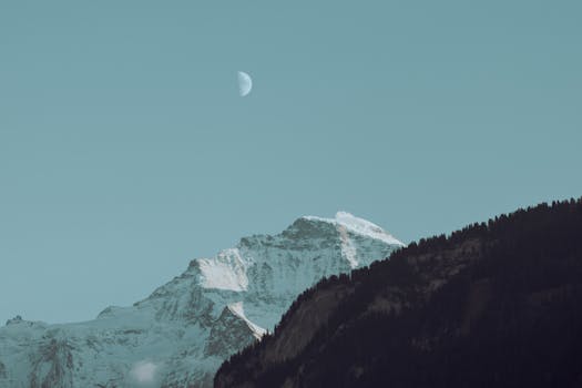 Stunning view of a moonlit mountain peak in Interlaken, Switzerland.