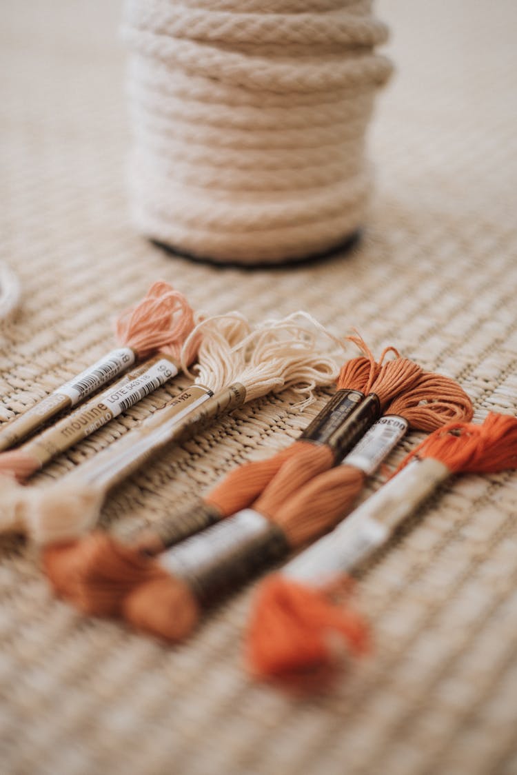 Skeins Of Embroidery Floss Lying On Mat