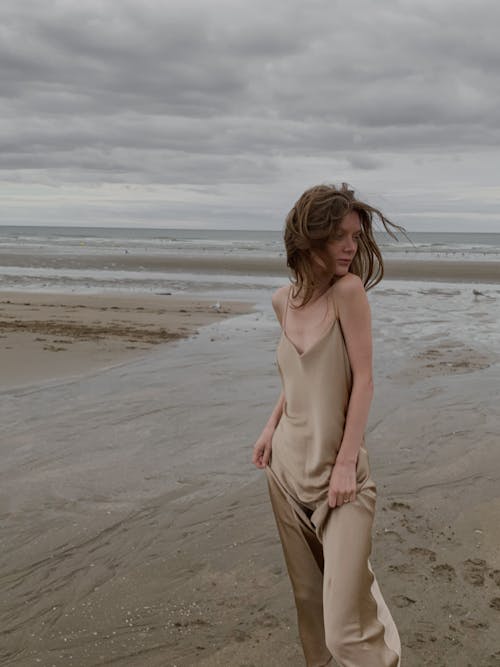 Woman Wearing Dress Standing on Shore