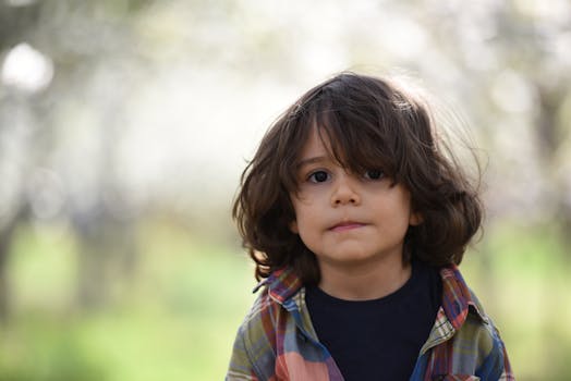 Boy Wearing Brown Sweatshirt · Free Stock Photo