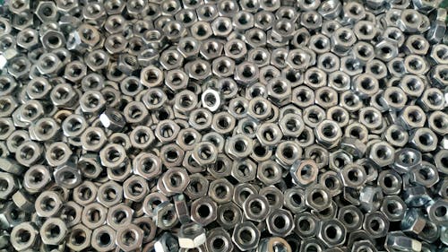 Free Pile of Silver Hex Nuts Stock Photo