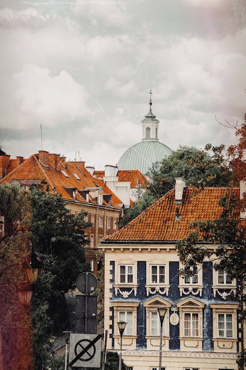 Free Photo of Buildings with Old Roofing of Clay Tiles and Dome of a Church Stock Photo