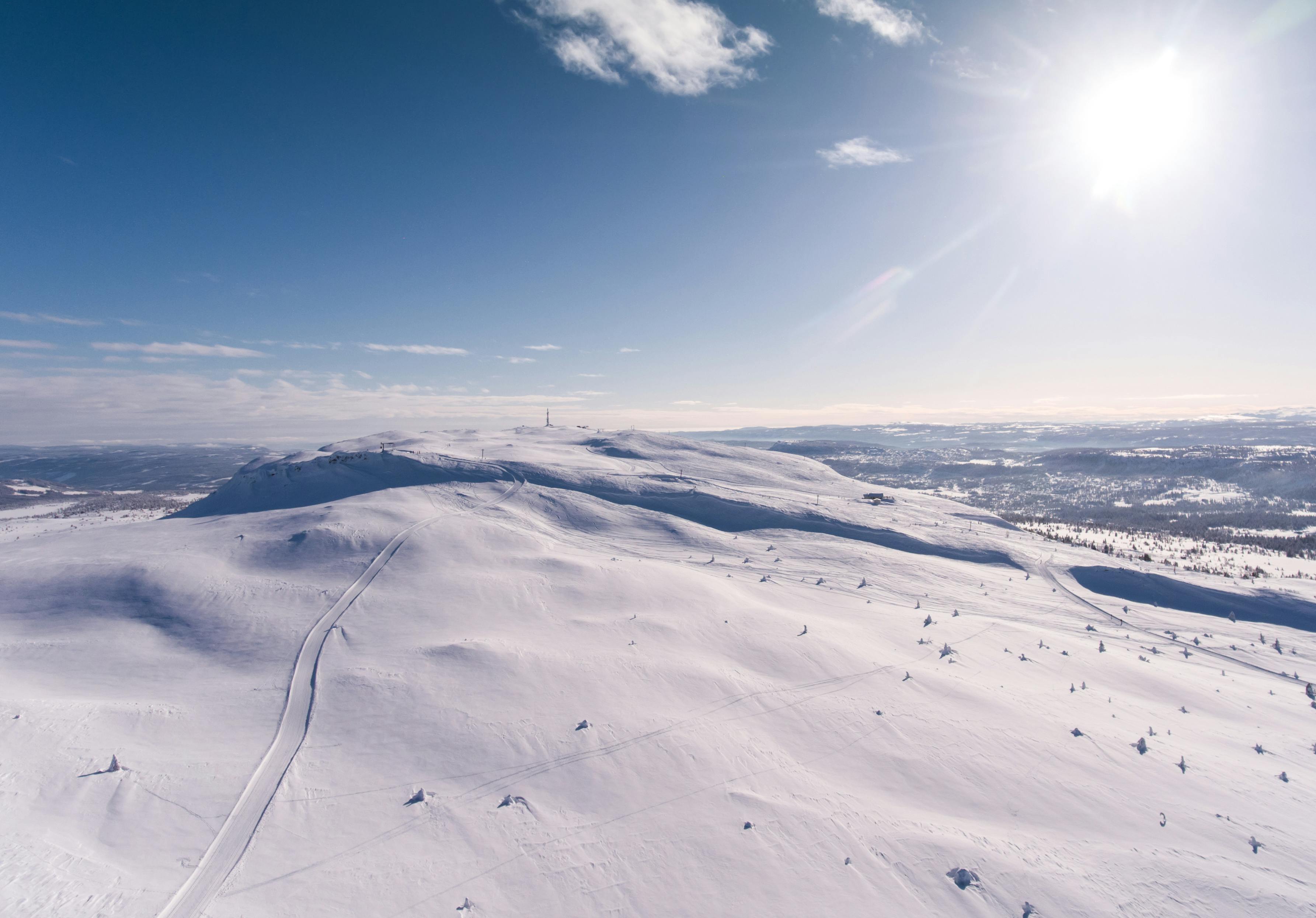 Aerial Photography Of Snowy Hill · Free Stock Photo