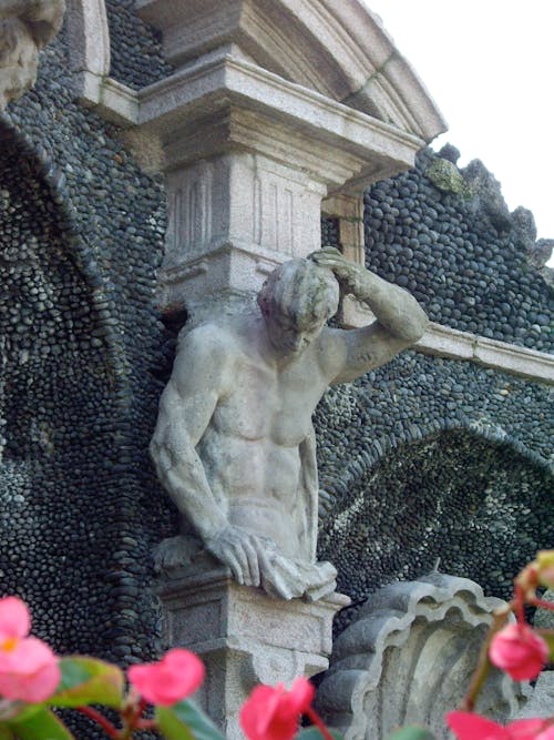Photo of a Statue Supporting a Renaissance Column