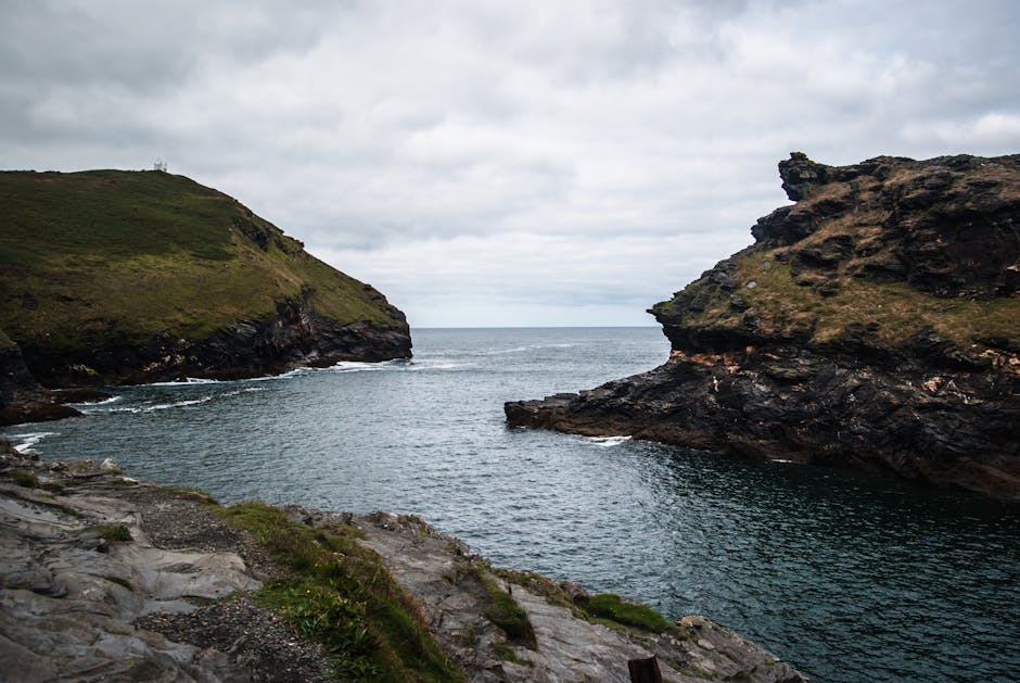 Wide Angle Photo of Body of Water Under Cloudy Sky · Free Stock Photo