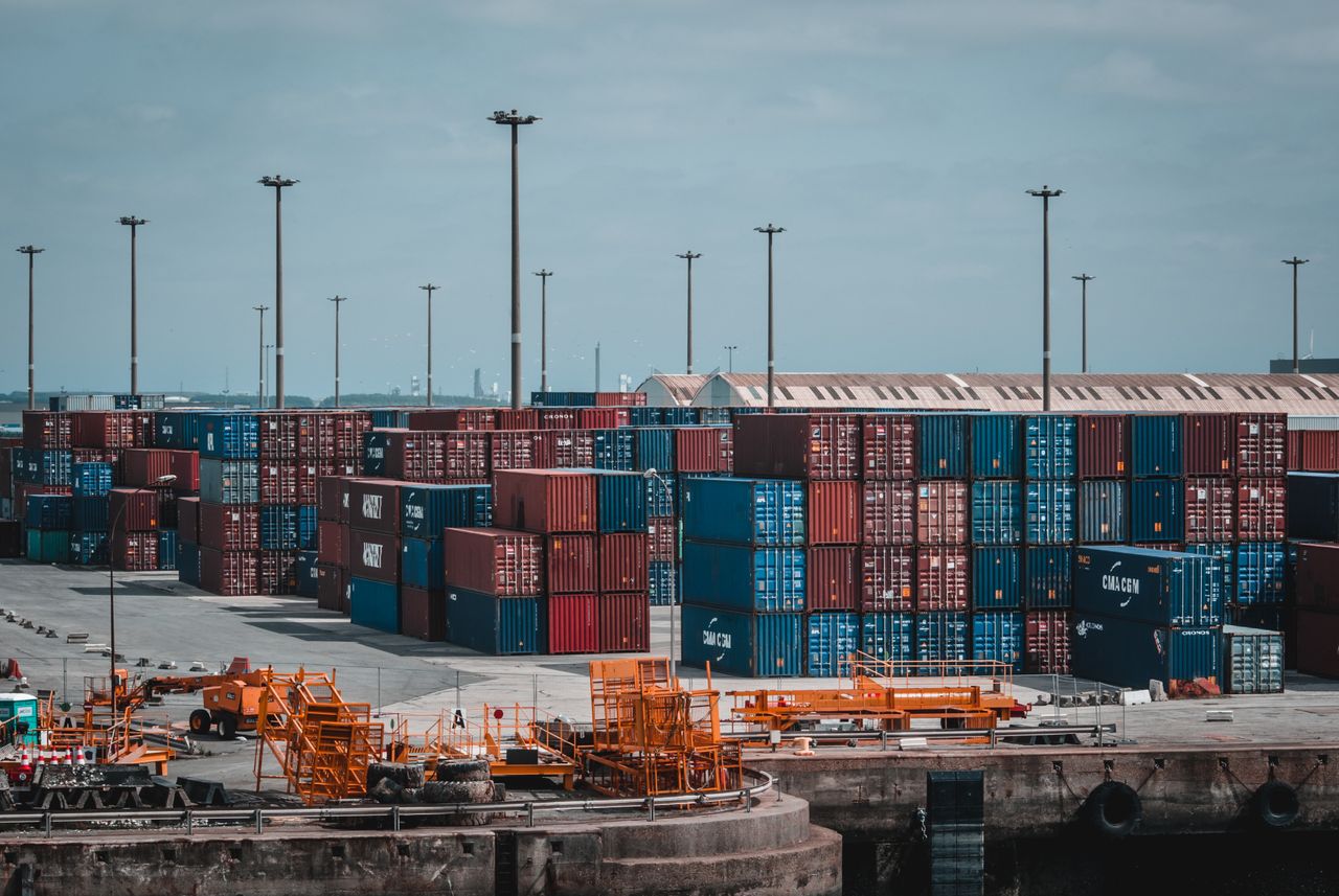 Modern logistics warehouse with fleet vehicles