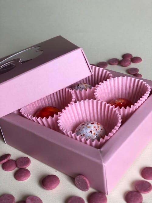 Close-up of a Pink Box of Chocolate Pralines 