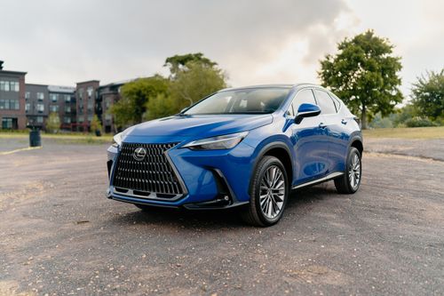 Free A stylish blue Lexus SUV parked in an outdoor urban area on a clear day. Stock Photo