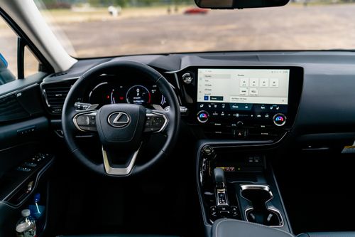 Free Detailed interior view of a Lexus car featuring a modern steering wheel and touchscreen dashboard. Stock Photo