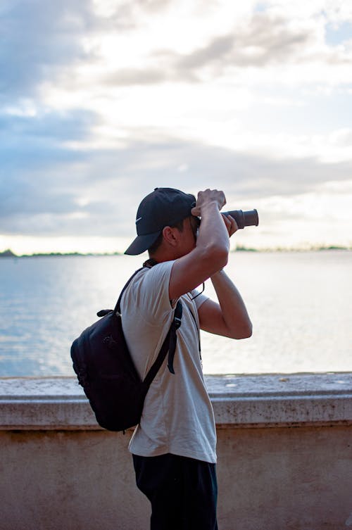 Man Taking Photo with a Camera