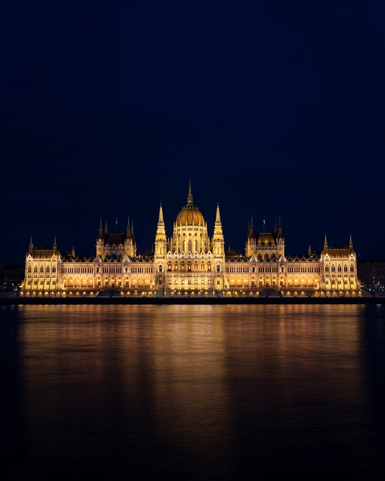 Night View Of Historical Parliament Building In Budapest Hungary