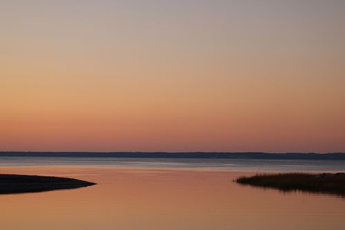 Free Tranquil sunset view of a calm body of water in Stamford, Connecticut. Stock Photo