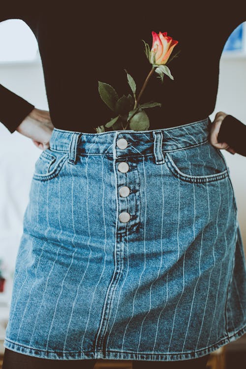 Free Woman In Black Long-sleeved Shirt And Blue Denim Skirt Stock Photo