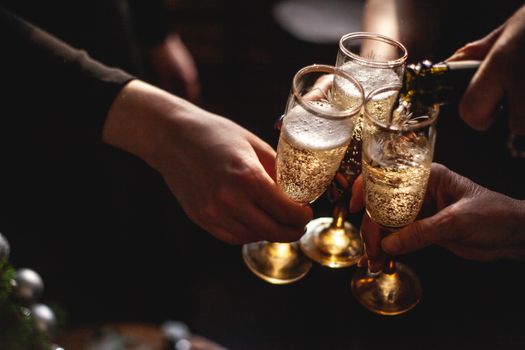 2 Person Holding Clear Drinking Glasses