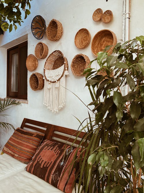 Wooden Bed Frame and Organic Decorations in a Bedroom 