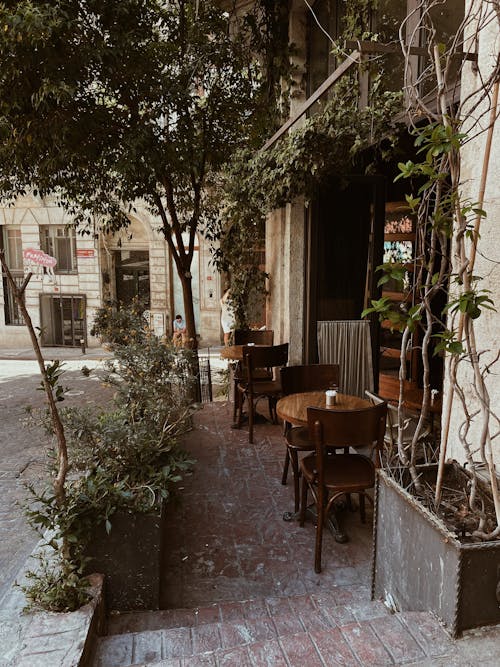 Wooden Furniture on a Cafe Patio in City