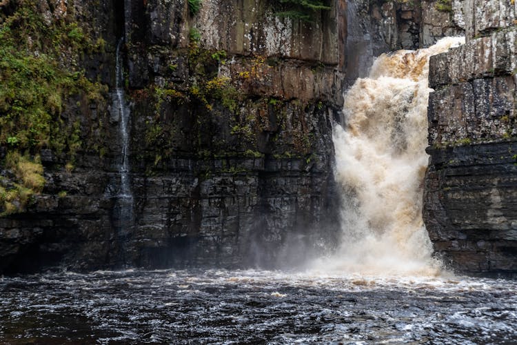 Photo Of Waterfalls On Cliff