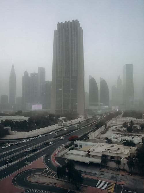 View of Modern Skyscrapers in City Center Covered in Fog 