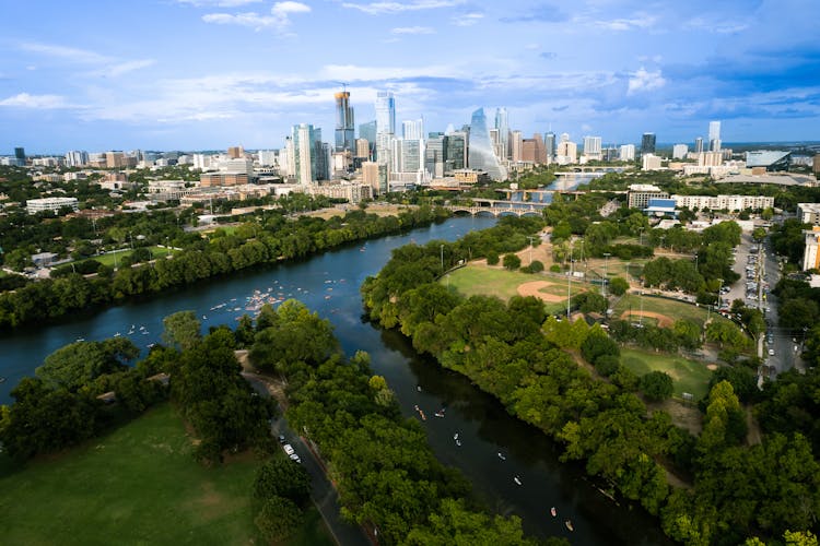 Aerial View Of River Flowing Through City