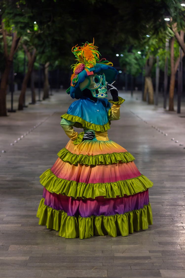 Skeleton In Colorful Dress Smoking Cigare