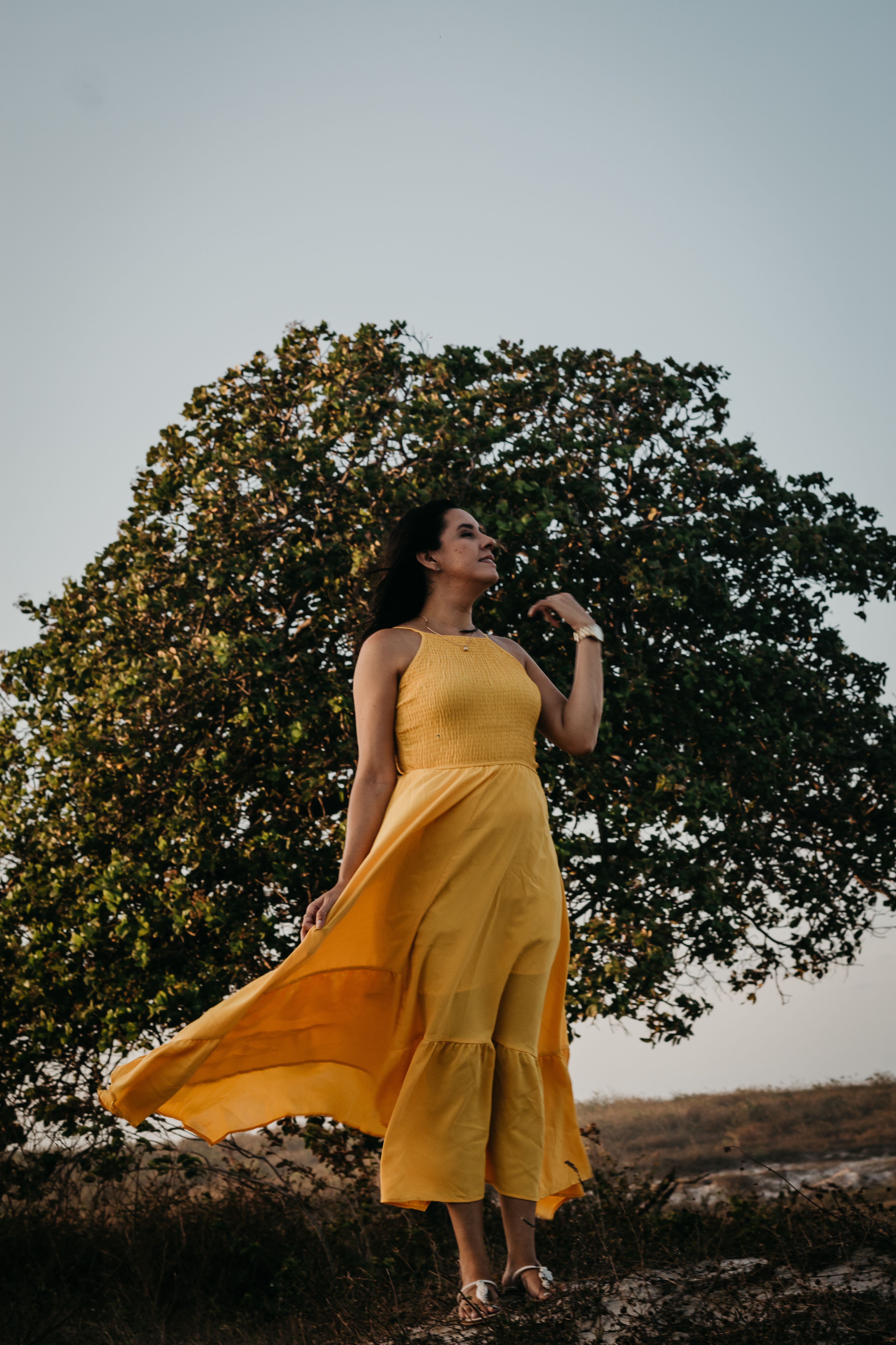 Woman in a Yellow Dress Standing near a Tree · Free Stock Photo