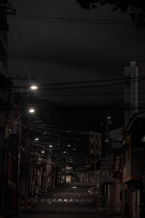 Free Street Lamps on Night Road Stock Photo