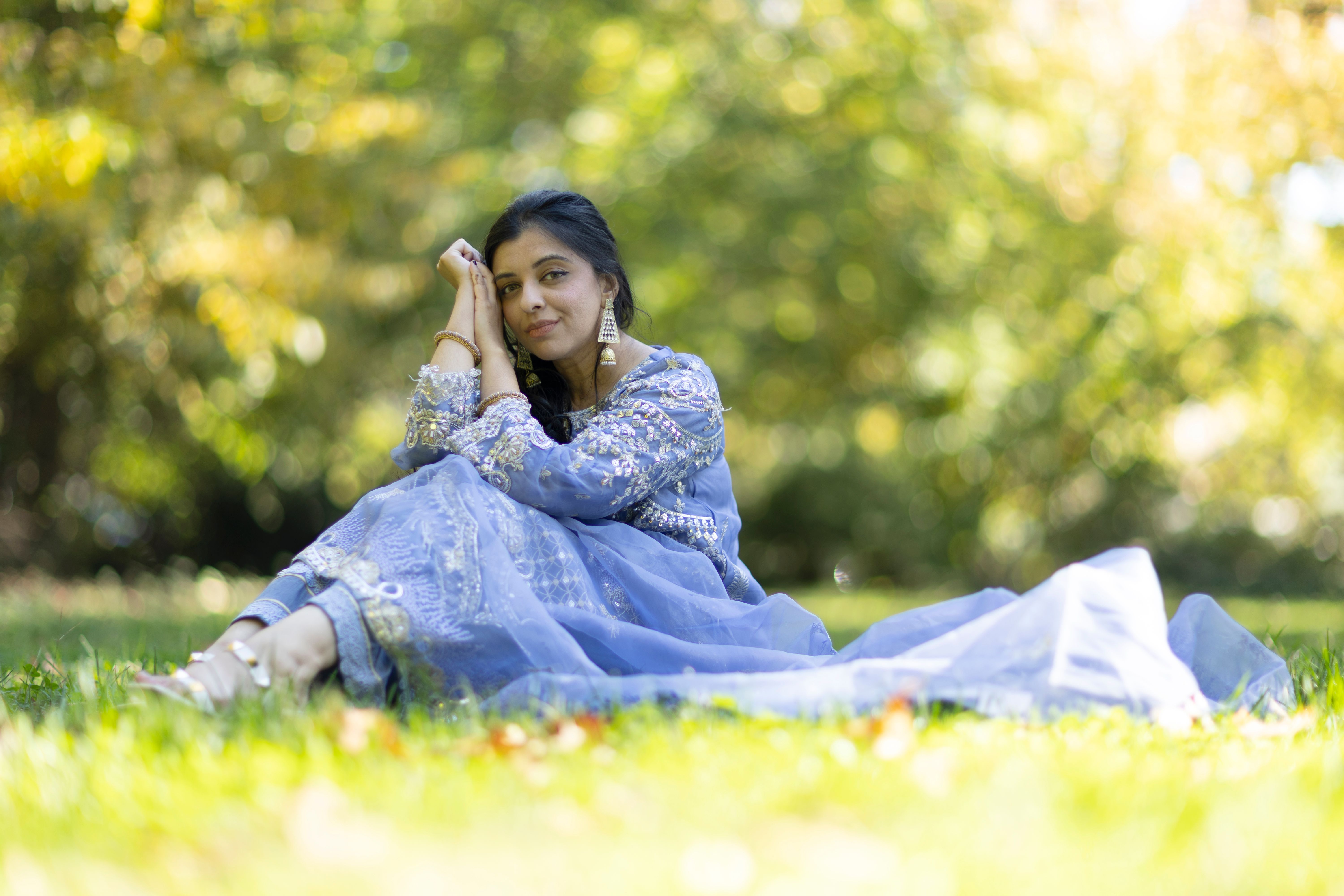 Woman in Blue Dress Sitting on Grass · Free Stock Photo