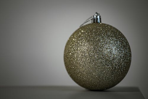 Close-up of a Golden Glitter Bauble 