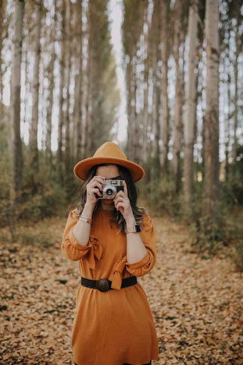 Free Woman Taking Photograph in Autumn  Stock Photo