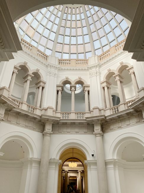 A breathtaking view of a classical architecture with a glass dome ceiling in London.