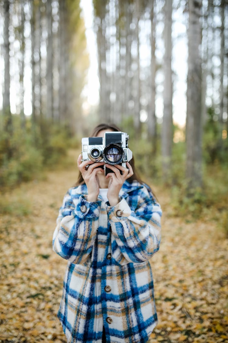 Person Taking Photo In Forest