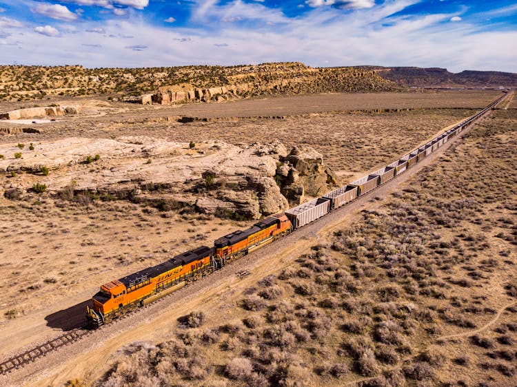 Freight Train Going Through Desert