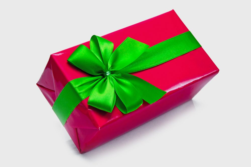 Small wrapped gift with a red ribbon