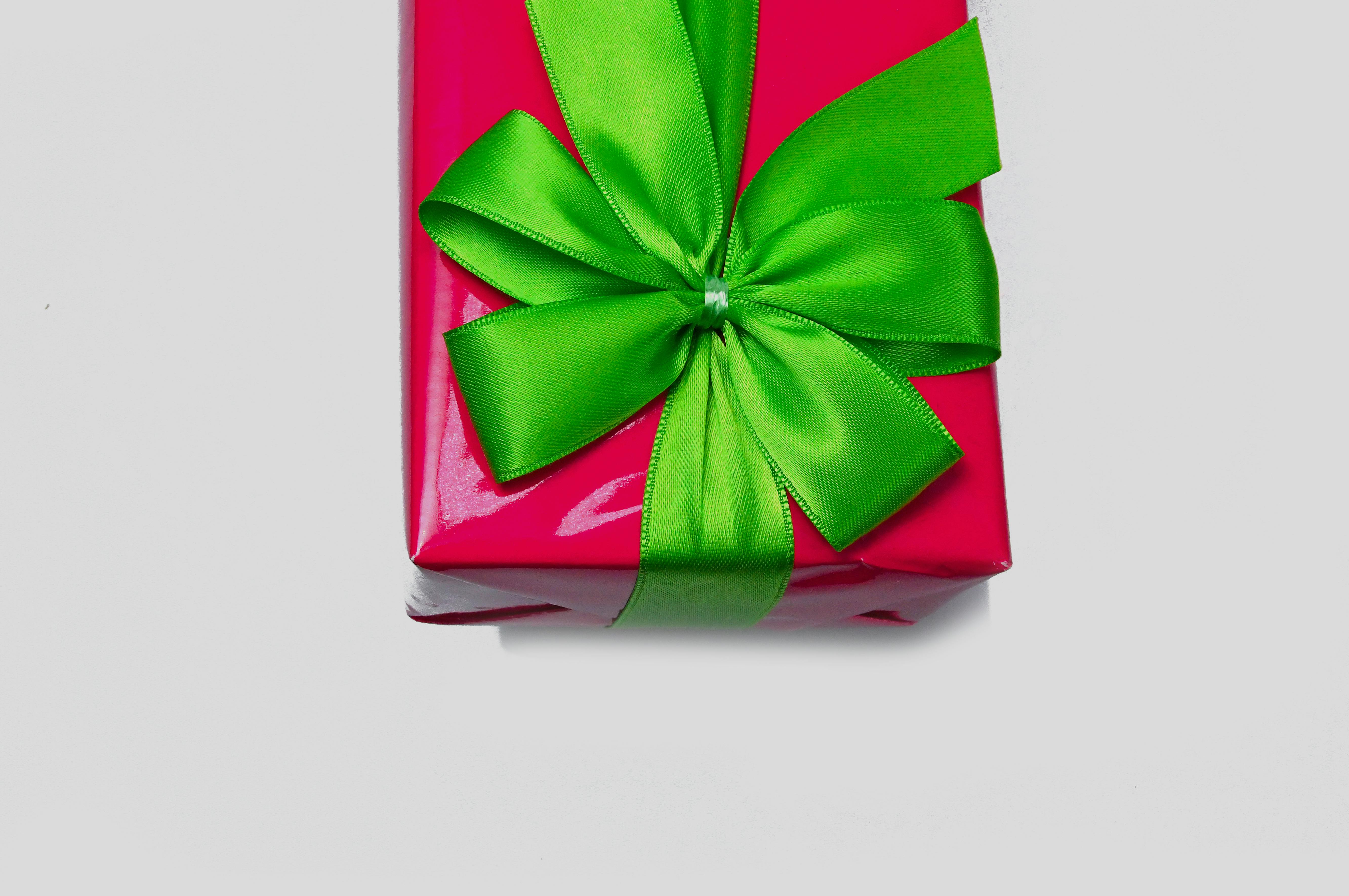 Gift Box Covered With Green Bow · Free Stock Photo