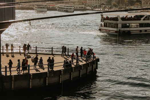 People on Brown Wooden Dock