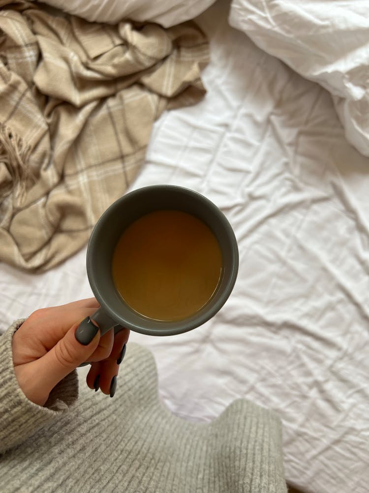 Woman Holding Coffee Mug