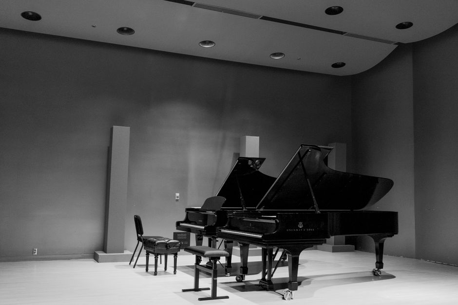 Pianist performing a Chopin concert in a historic venue in Warsaw, Poland