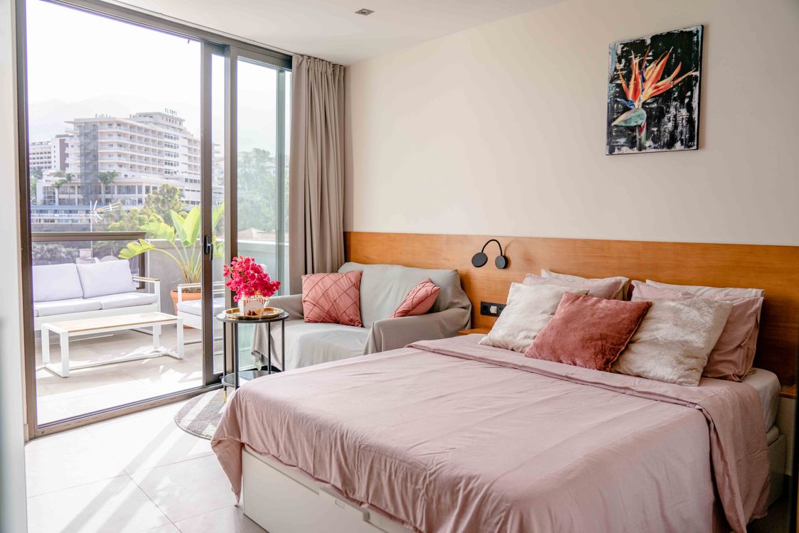 A Cozy Bedroom with City View · Free Stock Photo