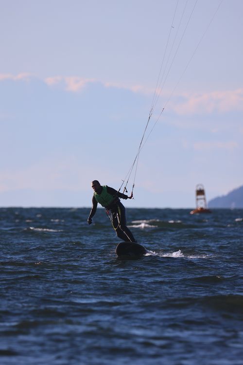 Free A kitesurfer rides the waves in Vancouver, capturing the essence of adventure sports. Stock Photo