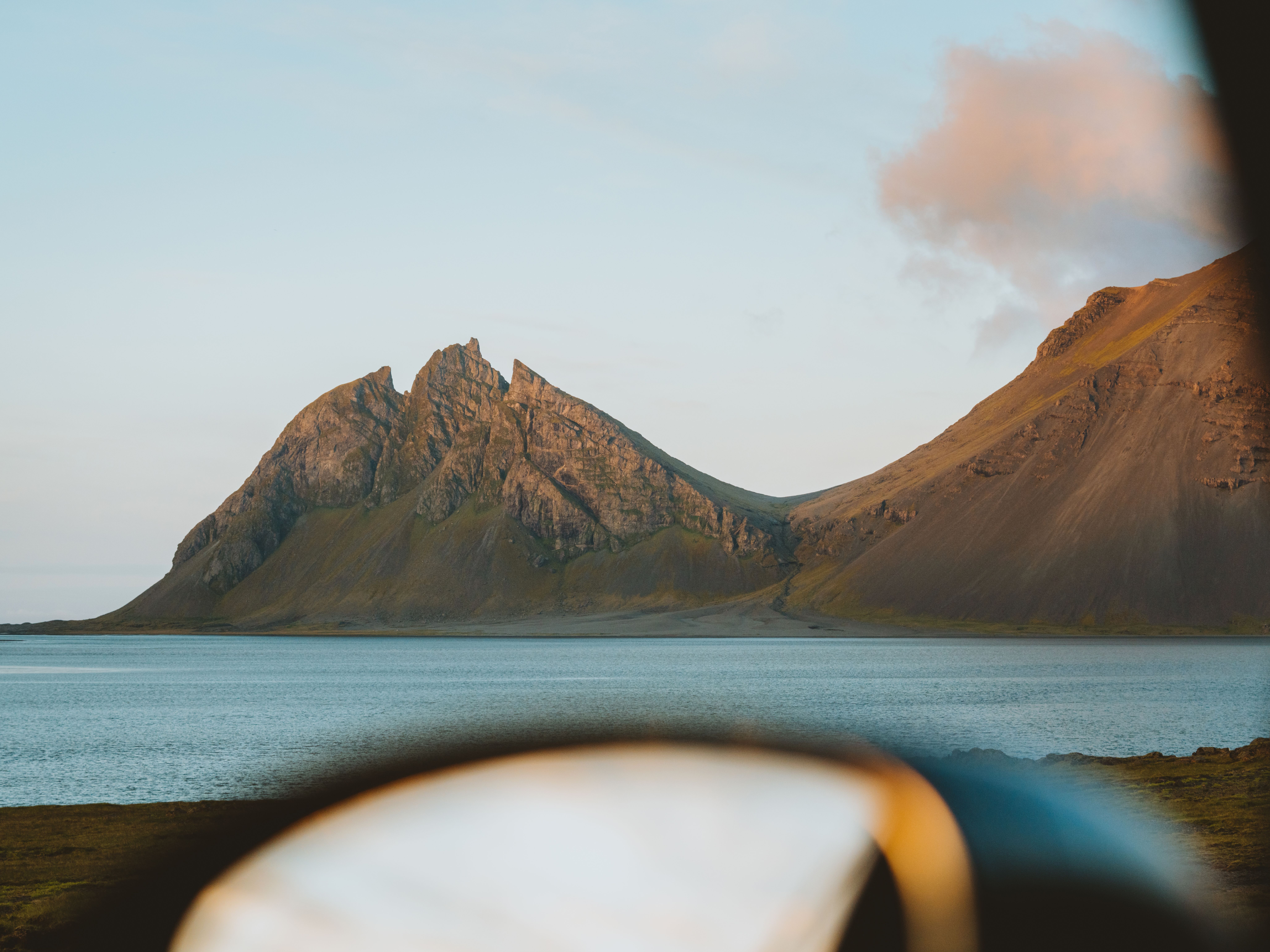 Brown Mountain Near Body of Water · Free Stock Photo
