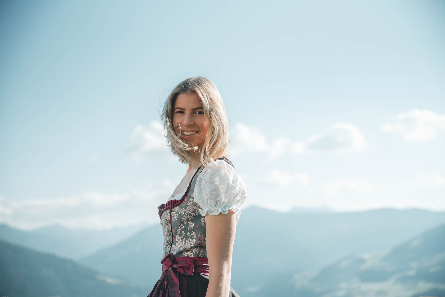 Authentic Bavarian Dirndl Online Shop 4 https://www.pexels.com/photo/smiling-woman-wearing-white-and-green-floral-cuff-shoulder-dress-1428962/