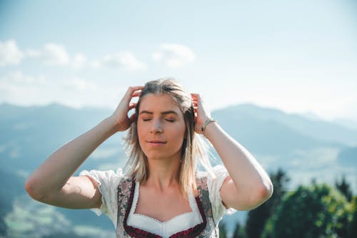Free Woman Fixing Her Hair Stock Photo
