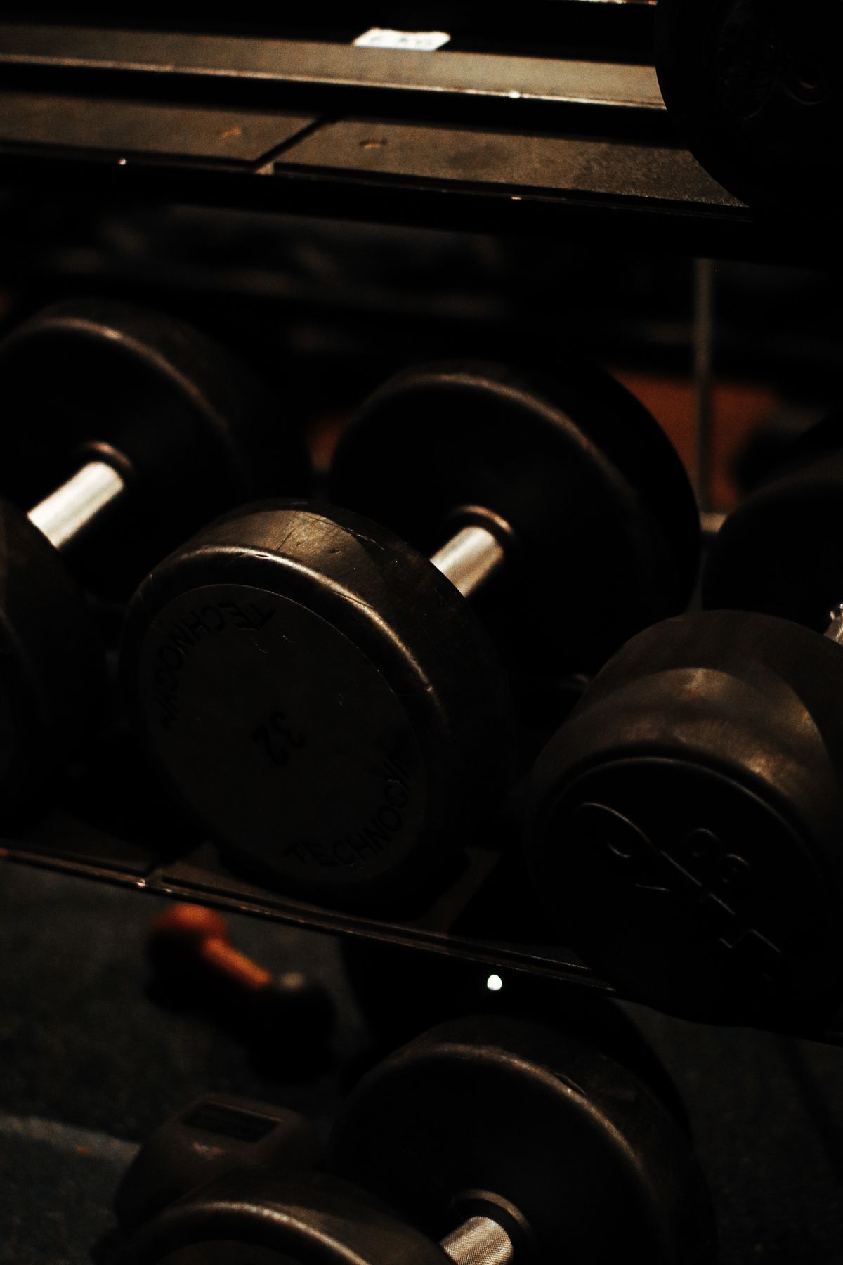 Dumbbells in a dark gym